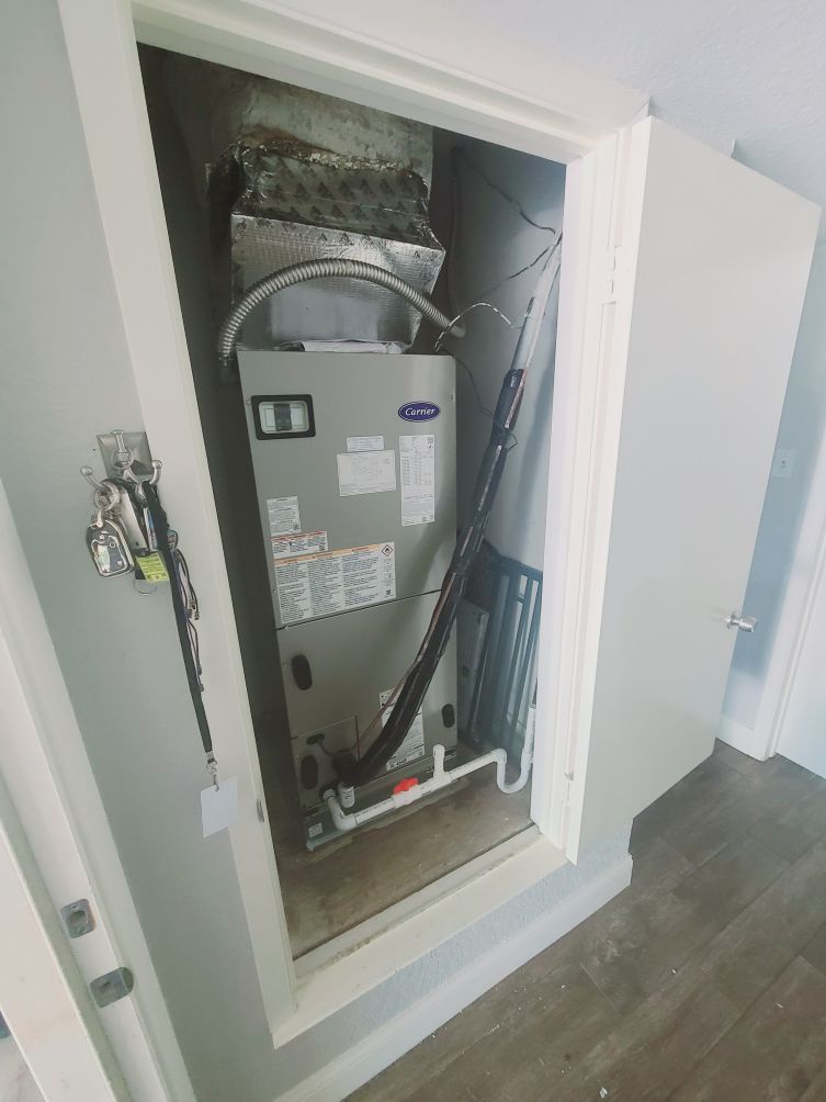 Comfort Conditioning Compact AC Closet View Image of an AC unit in a compact closet space, featuring Comfort Conditioning and highlighting the Comfort Conditioning compact AC closet view for space-saving climate control solutions.