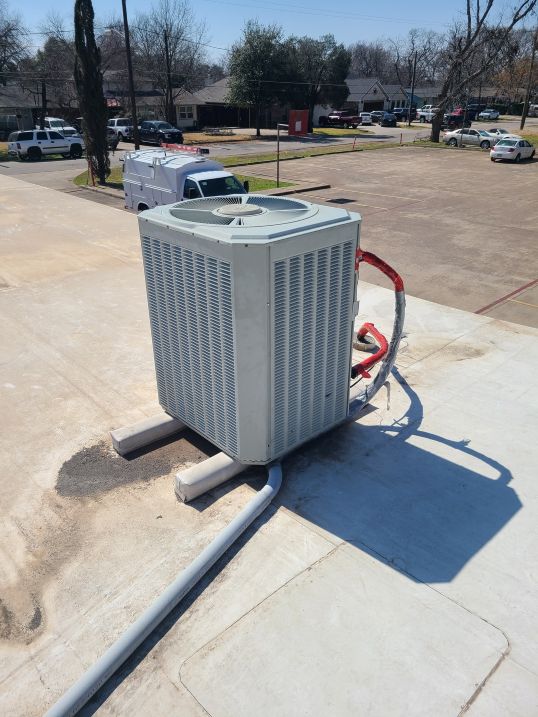 Image of HVAC equipment on a rooftop, featuring Comfort Conditioning and highlighting their rooftop unit service scene for efficient climate control solutions.