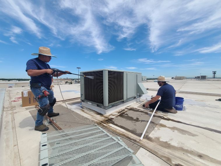 Image of an air conditioning unit, featuring Comfort Conditioning and highlighting AC installation with concrete pads and wired setup for stable and secure operation.