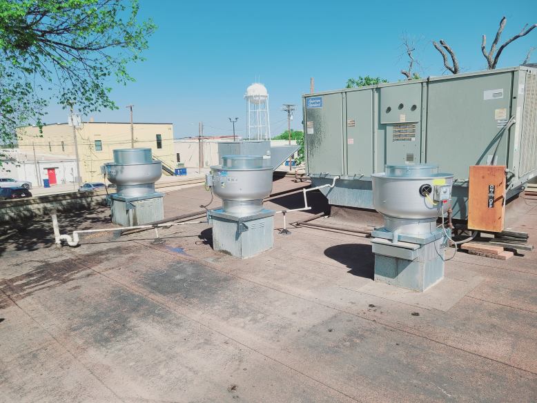 Image of an air conditioning unit, featuring Comfort Conditioning and highlighting AC installation with concrete pads and wired setup for stable and secure operation.