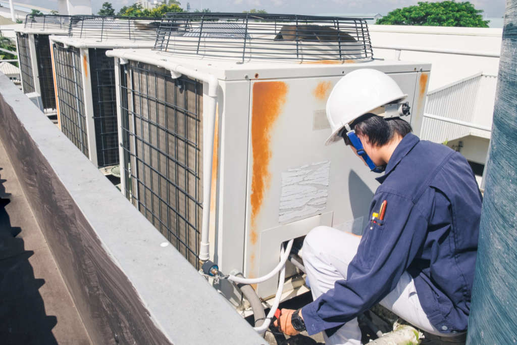 Image of an air conditioning unit, featuring Comfort Conditioning and highlighting AC installation with concrete pads and wired setup for stable and secure operation.