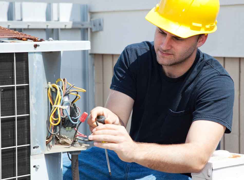 Reliable AC Repair in Justin, TX Image of an air conditioning technician at work, featuring Comfort Conditioning and highlighting reliable AC repair services in Justin, TX.
